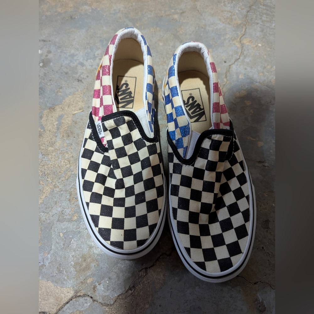 Vans Black and White Checkerboard Slip-Ons with Red and Blue Accents